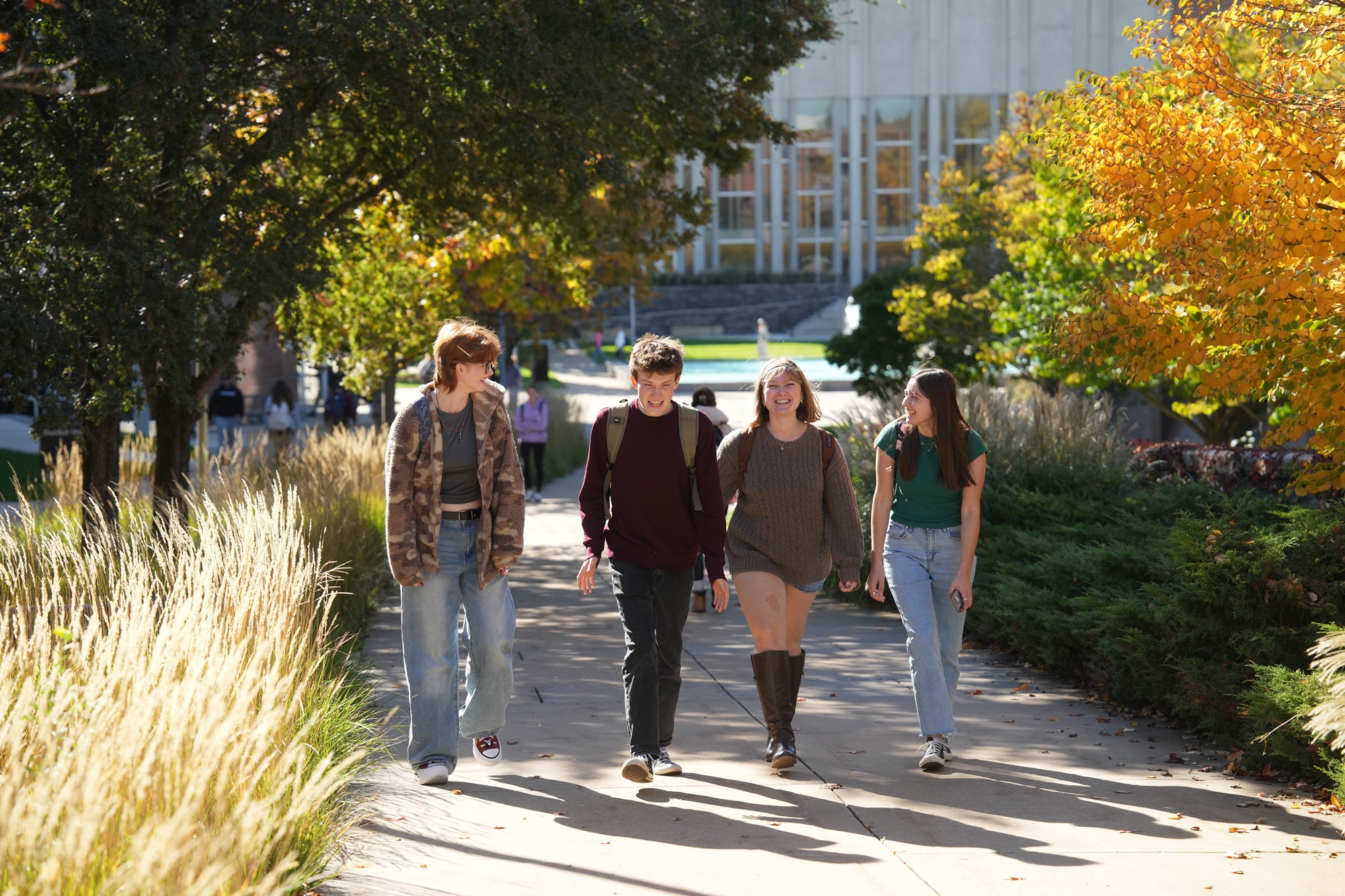Students walking on campus in autumn